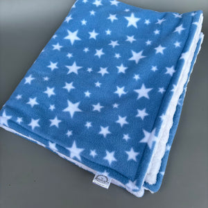 Blue stars fleece and white bubble fleece handling blankets for small pets.