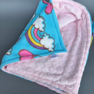 Pastel rainbows fleece and bubble fleece handling blankets for small pets.