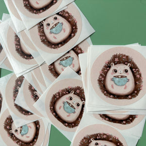 Hot chocolate hedgehog stickers. 51mm x 51mm circle gloss paper sticker.