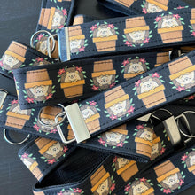 Load image into Gallery viewer, Hedgehog in plant pot wristlet keychain. Hedgehog keyring. Hedgehog wrist strap keyring.