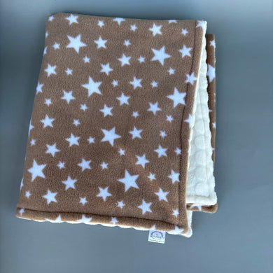 Beige stars fleece and cream bubble fleece handling blankets for small pets.