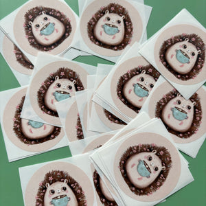 Hot chocolate hedgehog stickers. 51mm x 51mm circle gloss paper sticker.