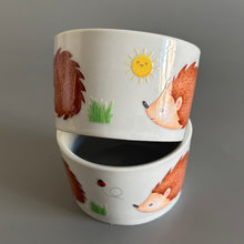 Load image into Gallery viewer, Stacked ceramic bowl with hedgehog illustrations on a grey background