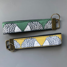 Load image into Gallery viewer, Hedgehog wristlet keyring. Spike hedgehog keychain. Green or mustard hedgehog wrist strap keyring.