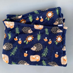 Navy hedgehogs cuddle fleece handling blankets for small pets. Fleece lap blankets.