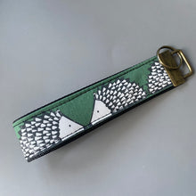 Load image into Gallery viewer, Hedgehog wristlet keyring. Spike hedgehog keychain. Green or mustard hedgehog wrist strap keyring.