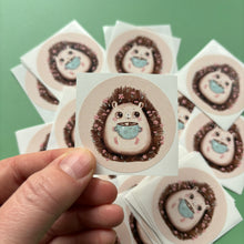 Load image into Gallery viewer, Hot chocolate hedgehog stickers. 51mm x 51mm circle gloss paper sticker.