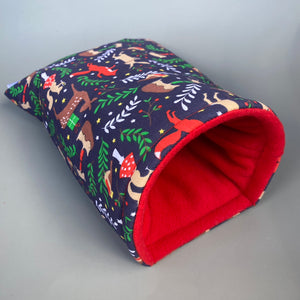 Navy festive party animals cosy snuggle cave. Padded stay open bed. Fleece pet bedding.