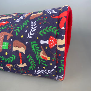 Navy festive party animals cosy snuggle cave. Padded stay open bed. Fleece pet bedding.