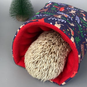 Navy festive party animals cosy snuggle cave. Padded stay open bed. Fleece pet bedding.