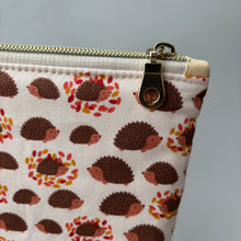 Load image into Gallery viewer, Cream and brown hedgehog zipper pouch. Makeup bag, small cosmetic zip pouch.