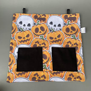 Pumpkin and skulls Halloween guinea pigs hanging hay bag for guinea pigs.