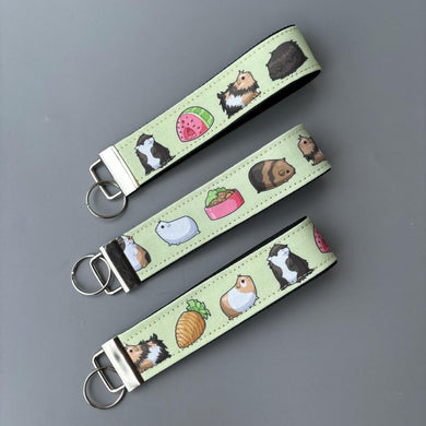 Guinea pig wristlet keychain. Guinea pig keyring. Guinea pigs wrist strap keyring.