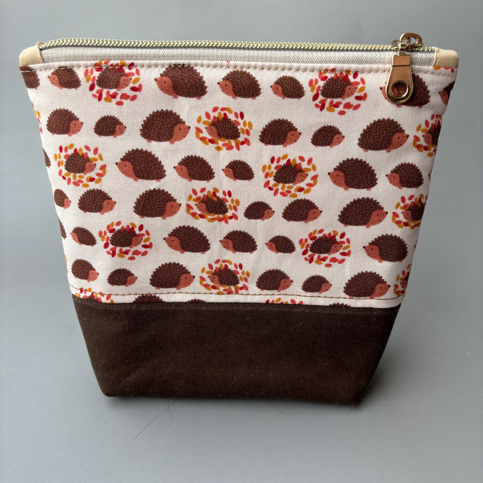 Cream and brown hedgehog zipper pouch. Makeup bag, small cosmetic zip pouch.