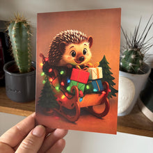 Load image into Gallery viewer, Pack of 6 sleigh hedgehog Christmas cards. Festive hedgehog cards. Happy holidays cards.