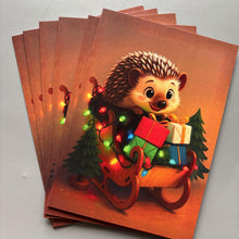 Load image into Gallery viewer, Pack of 6 sleigh hedgehog Christmas cards. Festive hedgehog cards. Happy holidays cards.