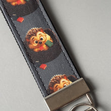 Load image into Gallery viewer, Reading hedgehog keychain. Hedgehog keyring. Hedgehog key fob.