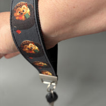Load image into Gallery viewer, Reading hedgehog wristlet keychain. Hedgehog keyring. Hedgehog wrist strap keyring.