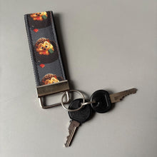 Load image into Gallery viewer, Reading hedgehog keychain. Hedgehog keyring. Hedgehog key fob.