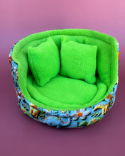 Load image into Gallery viewer, Dinosaur cuddle cup. Hedgehog and small pet bed. Fleece pet sofa bed.