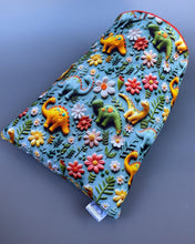 Load image into Gallery viewer, Dinosaur cosy snuggle cave. Padded stay open snuggle sack. Hedgehog bed. Fleece pet bedding.