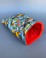 Load image into Gallery viewer, Dinosaur cosy snuggle cave. Padded stay open snuggle sack. Hedgehog bed. Fleece pet bedding.