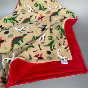 Dinosaur and red light cuddle fleece handling blankets for small pets.