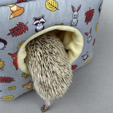 Load image into Gallery viewer, Grey and yellow woodland animals cosy cube house. Hedgehog and guinea pig padded fleece lined house.