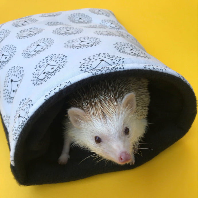 The Hoghouse black and white hedgehog cosy snuggle cave. Padded stay open hedgehog bed.